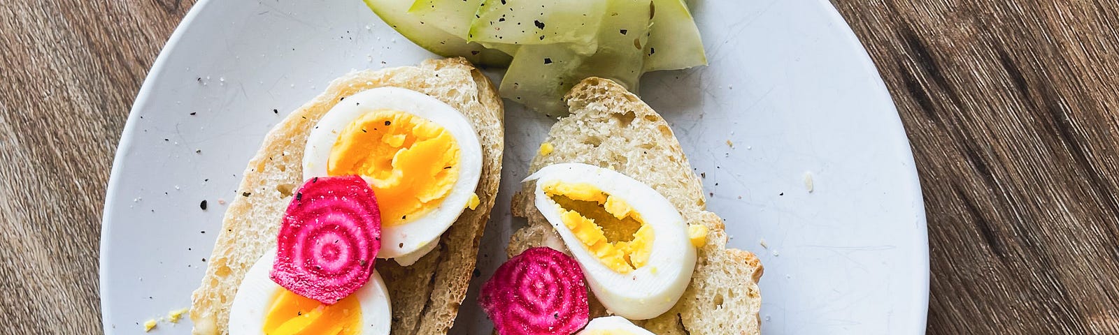 Two slices of homemade bread topped with eggs and garden-fresh beets.