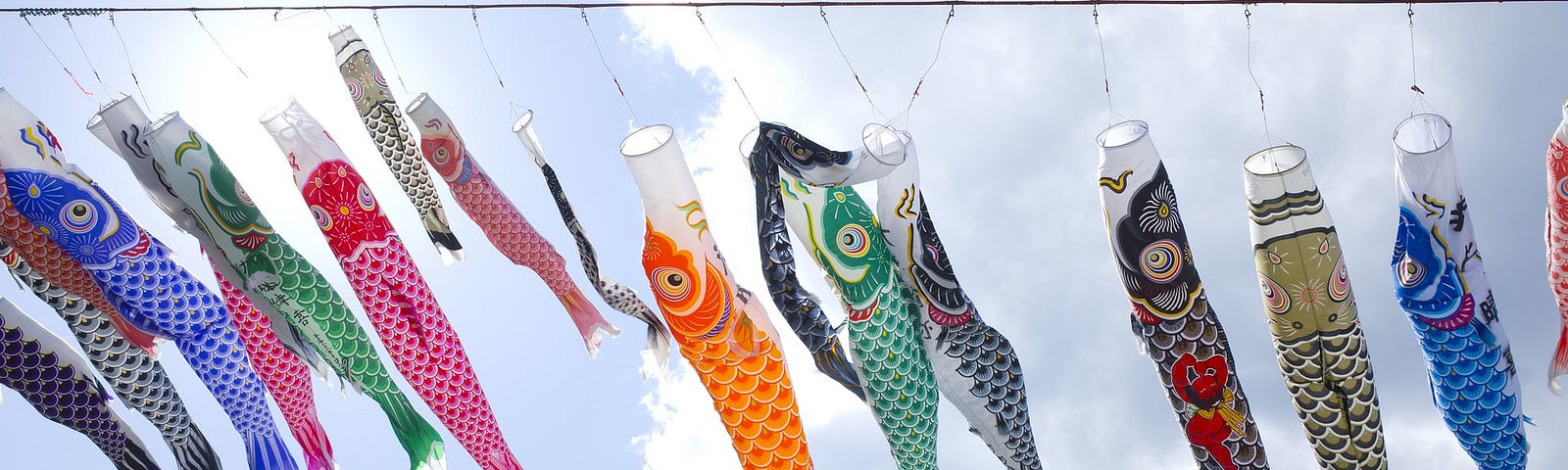Carp streamers against a blue sky are decorations for Children's Day in Japan.