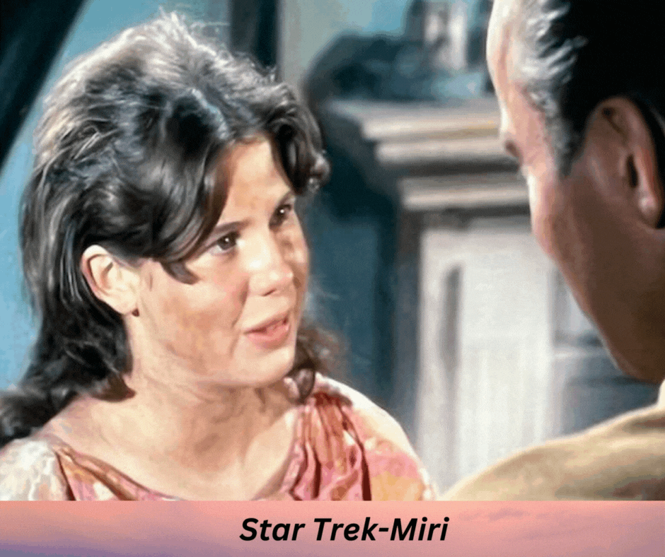 A teenage girl with dark hair and orange dress is looking at Captain Kirk. Star Trek