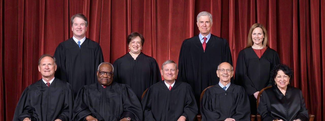 A picture of the nine Supreme Court Justices.
