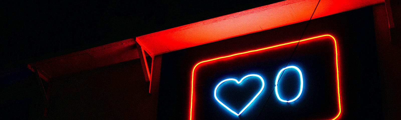 Neon sign in the shape of a like and comment button.