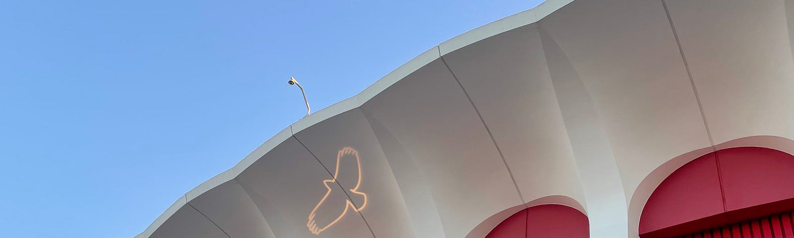 The outlined image of a hawk is projected in light on the underside of Los Angele Forum exterior prior to the Taylor Hawkins Tribute concert in Los Angeles, 27 September 2023.