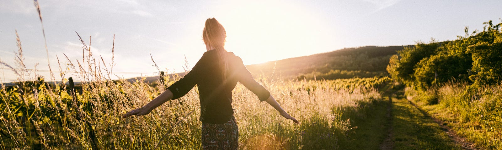 A woman standing in a wheat field