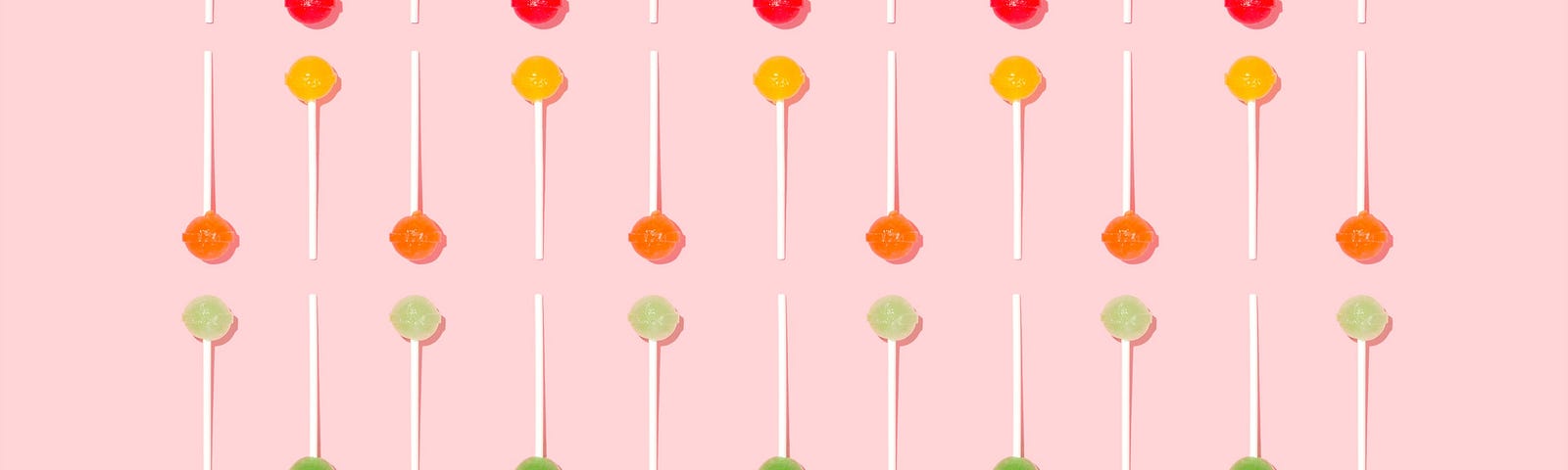candy suckers lined up in rows, sorted by color