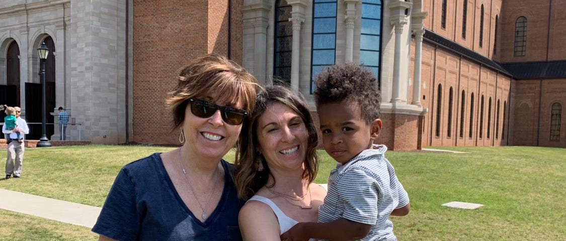 Author’s family photo shows two women smiling, with one holding a young child.