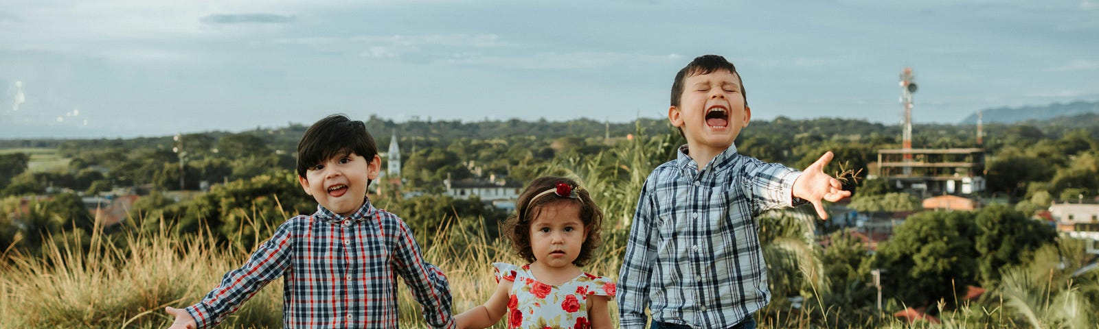 Photo by Catalina Carvajal Herrera: https://www.pexels.com/photo/children-standing-on-grass-for-a-family-picture-13247076/