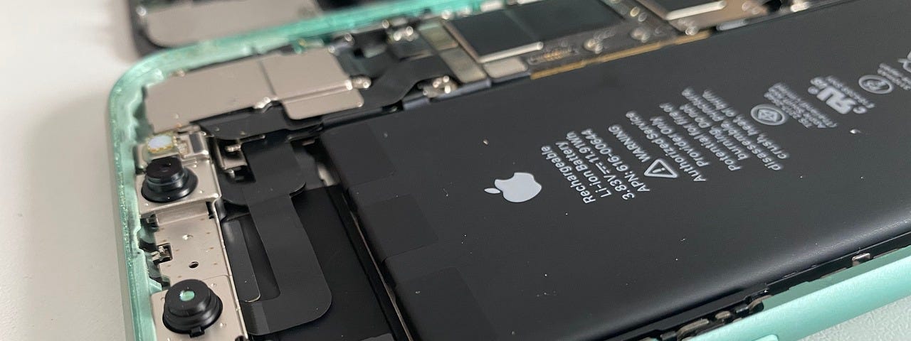 IMAGE: An open iPhone showing its battery