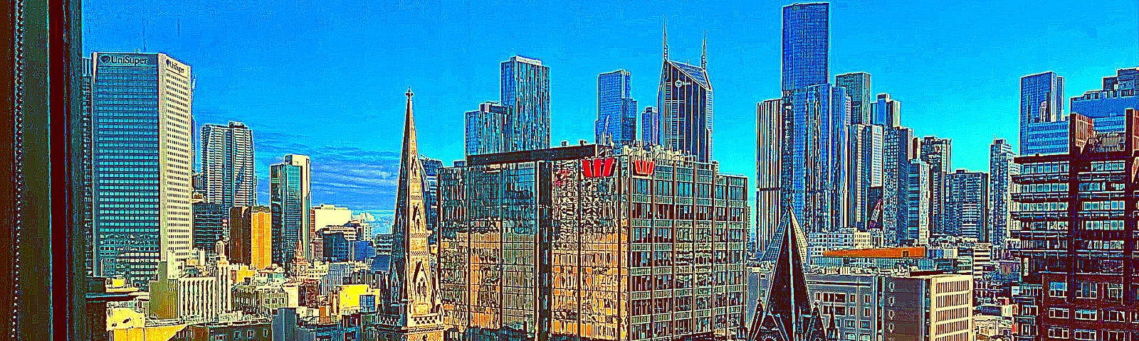A digitally, colour-enhanced image of a city skyline taken from an upper-storey window.