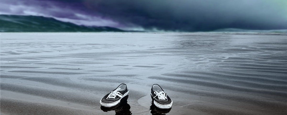 Shoes on beach with reflection of person but no person in the shoes. Image by glasskid50 onPixabay