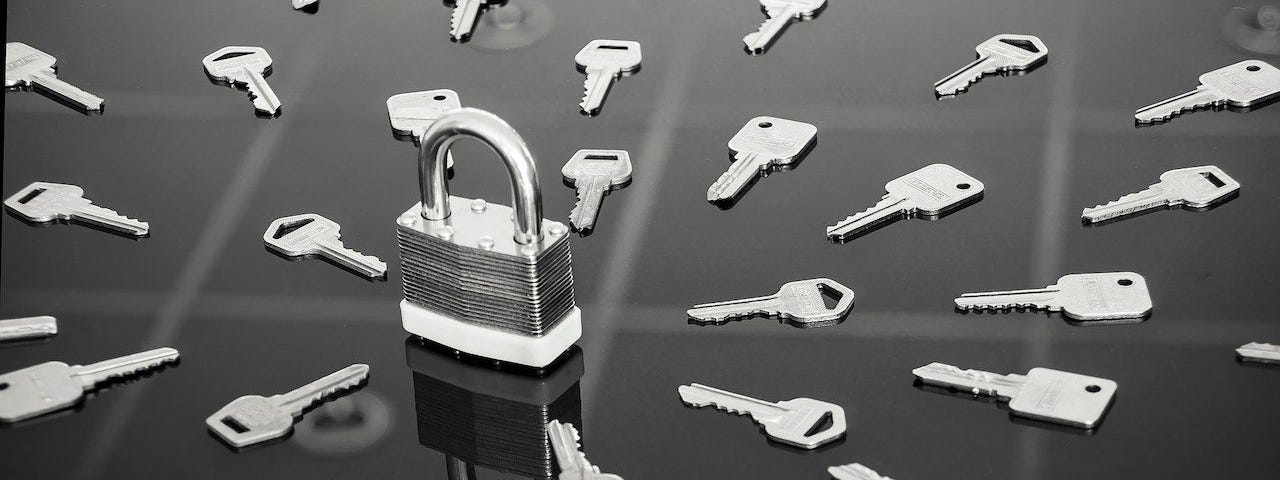 A lock surrounded by many keys