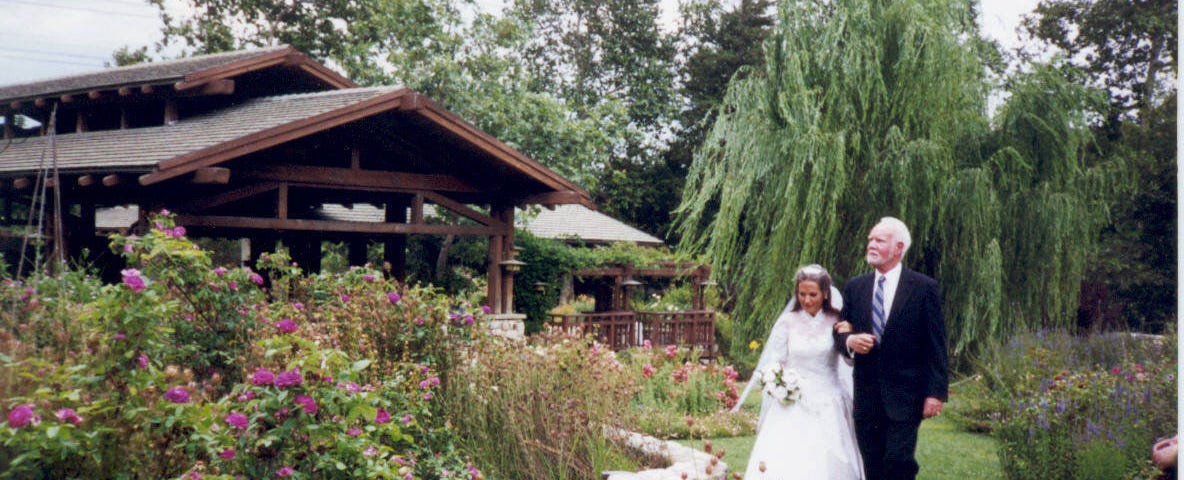 Charlotte Laws at her actual wedding, escorted by her professor to the altar