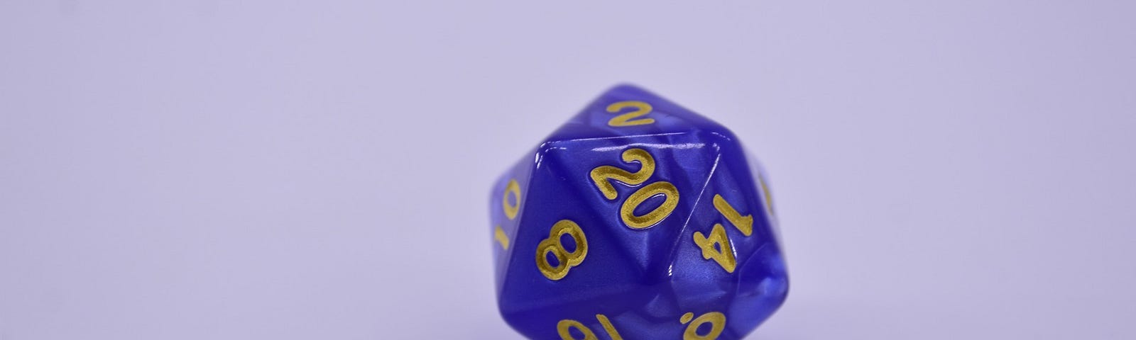 A picture of a twenty-sided dice, coloured in shades of blue and golden numbers.