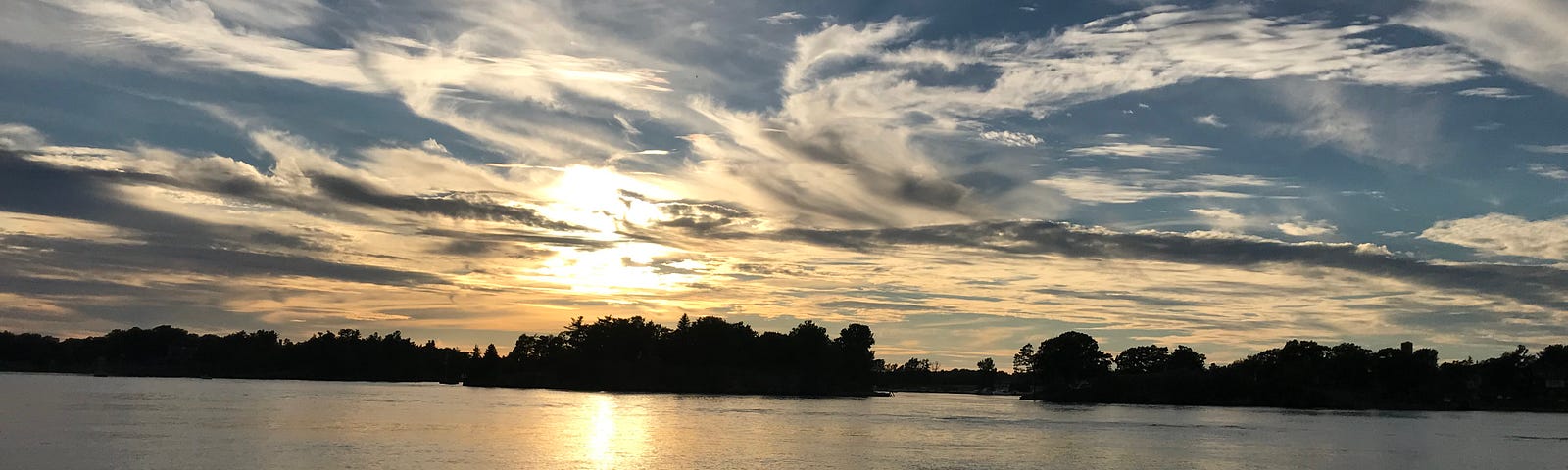 Photo of St. Lawrence River at dusk from Alexandria Bay, N.Y., that looks like a Van Gogh painting