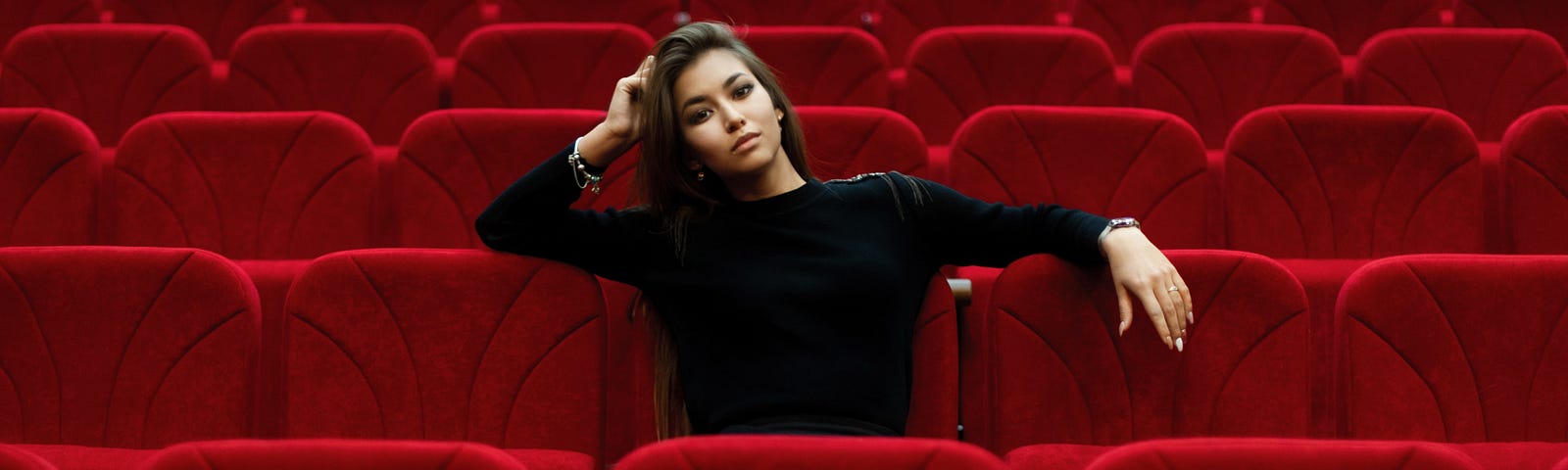 Actor sitting in empty theater
