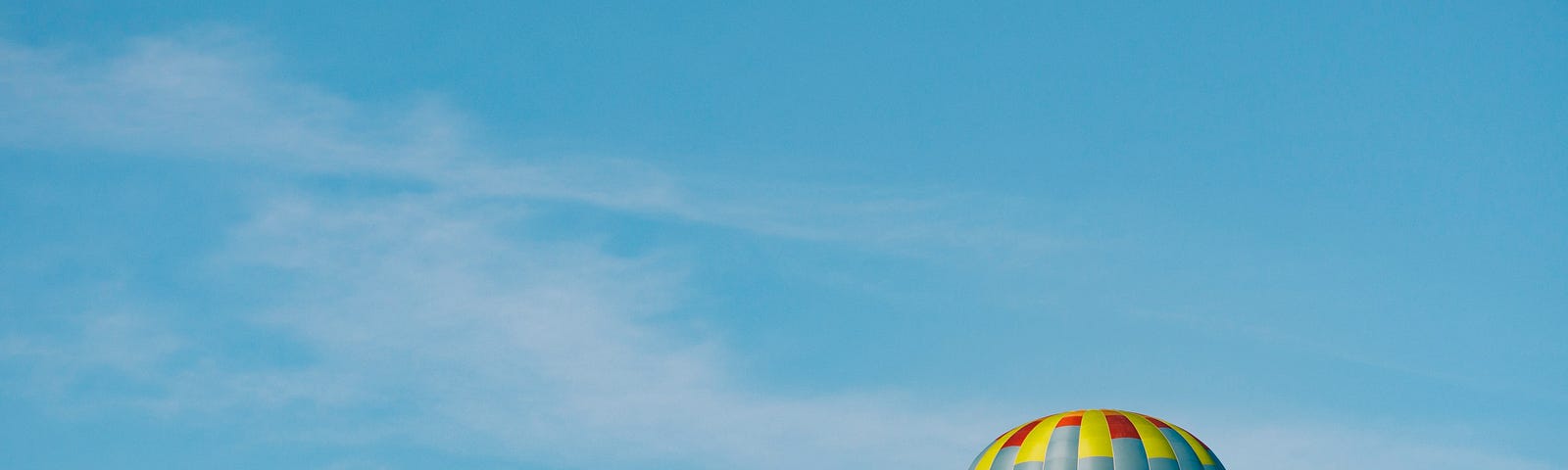colorful hot air balloon against a blue sky