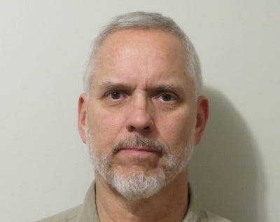 Caucasian male, with short grey hair and close cropped beard.