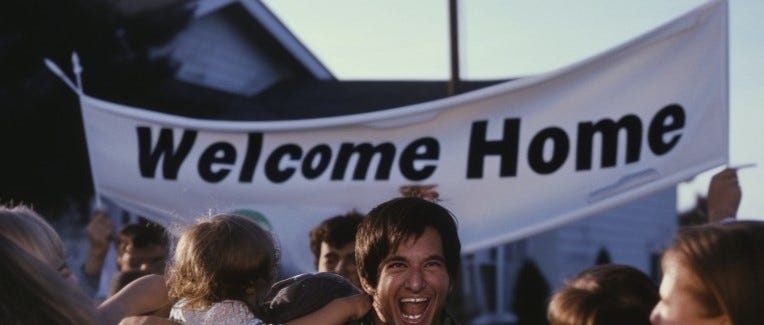 A crowd sheering in front of a Welcome Home sign