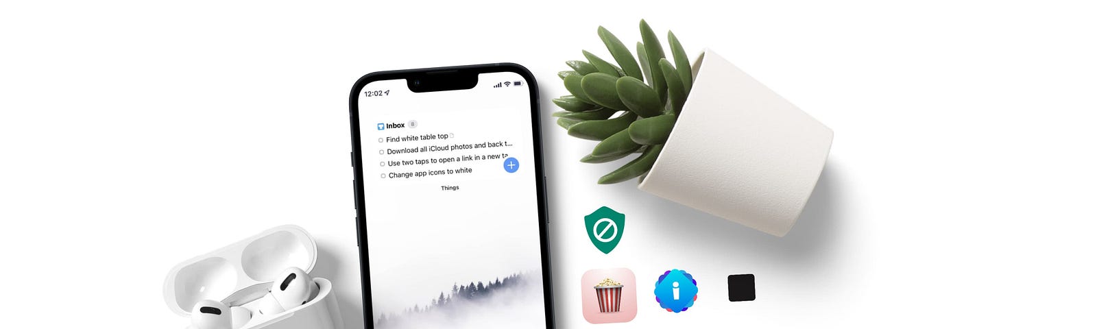 Image of an iPhone on top of a white surface with a plant and an AirPods next it.