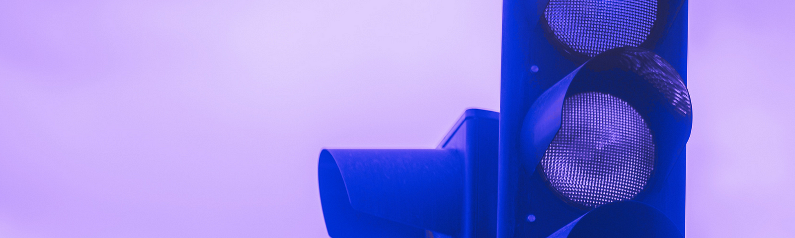 Image of a stoplight in purple wash, so that the red light appears blue.