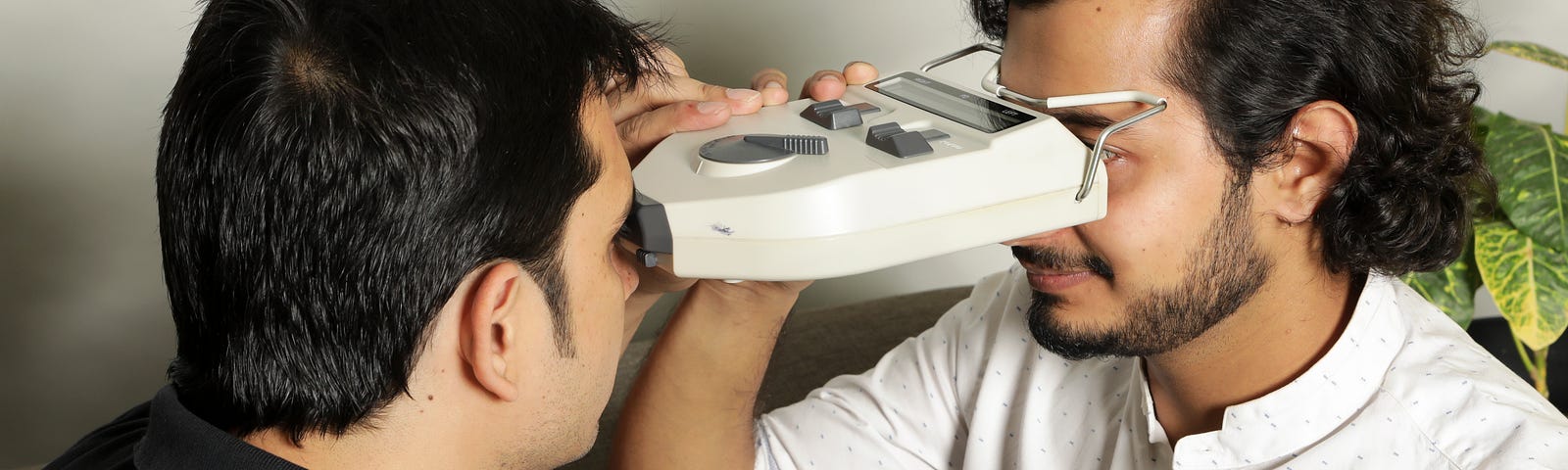 Man getting an eye test done with equipment