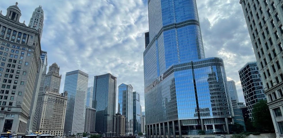 Chicago River runs between tall buildings