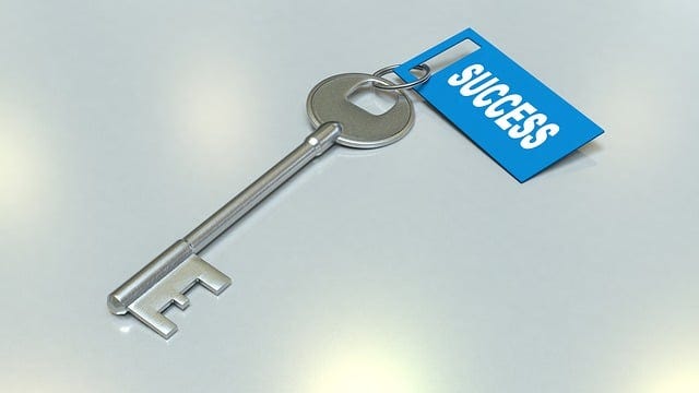 Photo of a key with the word “success” written on the key tag