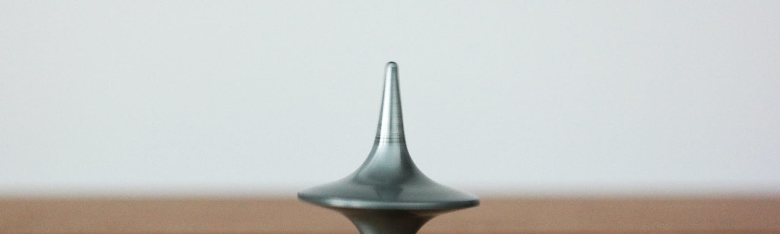 gray spinning top on bench