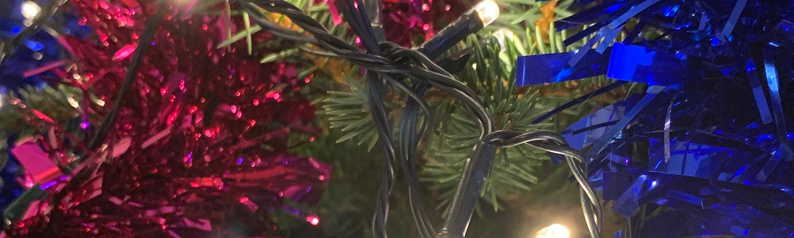 close-up of tinsel and christmas lights