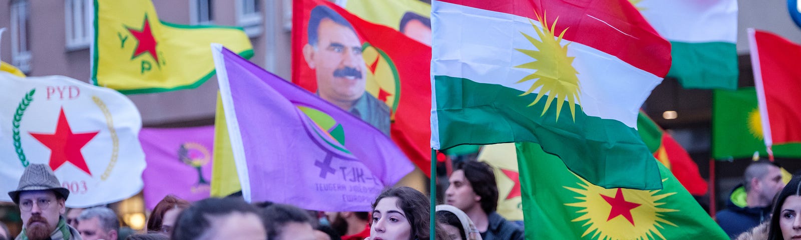 Thousands of people with flags protesting against the Turkish military forces’ attacks on Kurdish fighters and civilians in northern Syria. Photo by Magnus Persson/SOPA Images/LightRocket via Getty Images.
