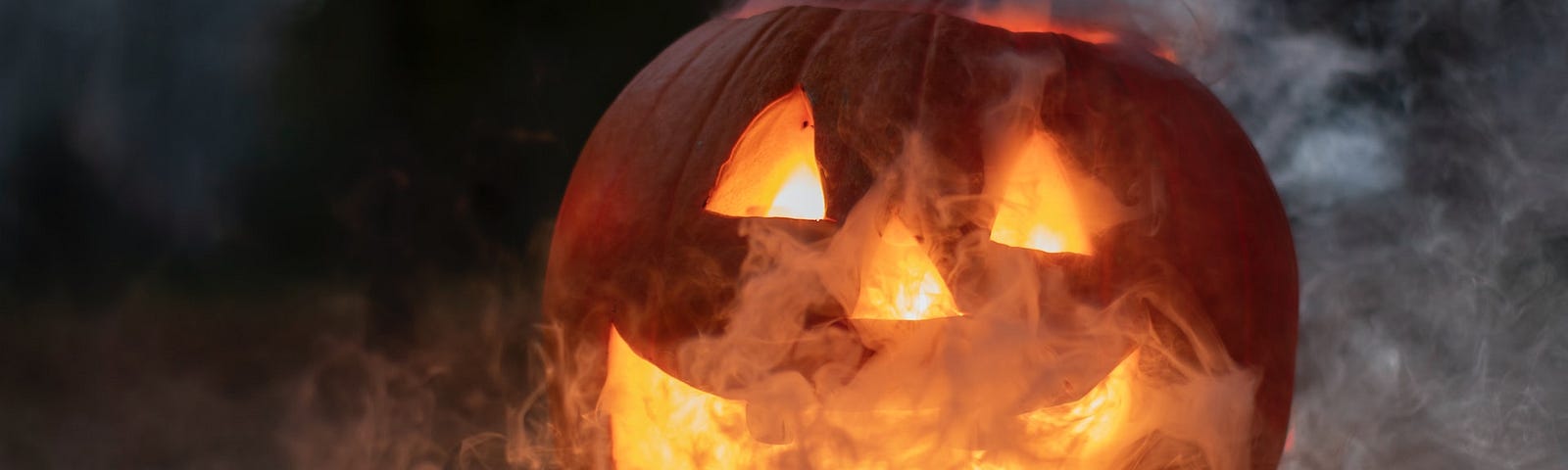 A pumpkin with smoke coming out