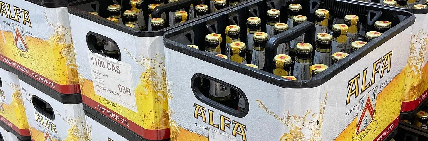 Dozens of Alfa Beer bottles ready to drink.