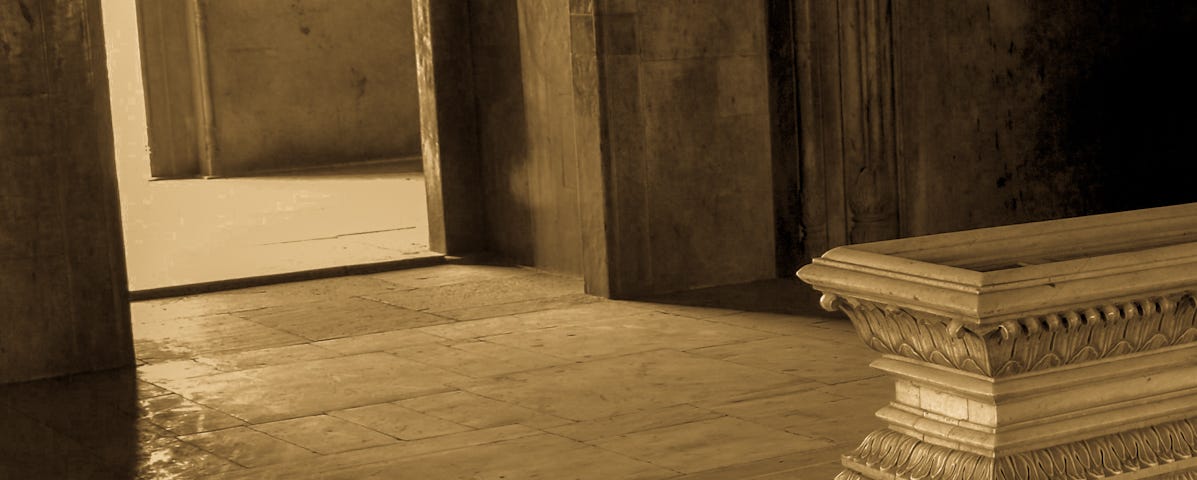 A marble cenotaph in a Mughal tomb.