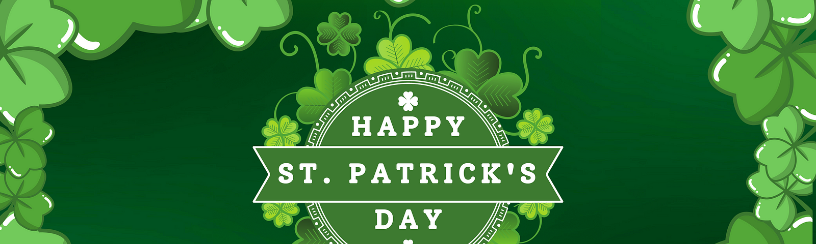 green background of shamrocks with words Happy St. Patrick’s Day