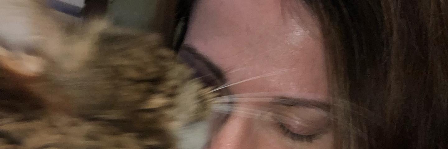 My cat Boots nuzzling my face.