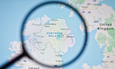 A magnifying glass examining Northern Ireland