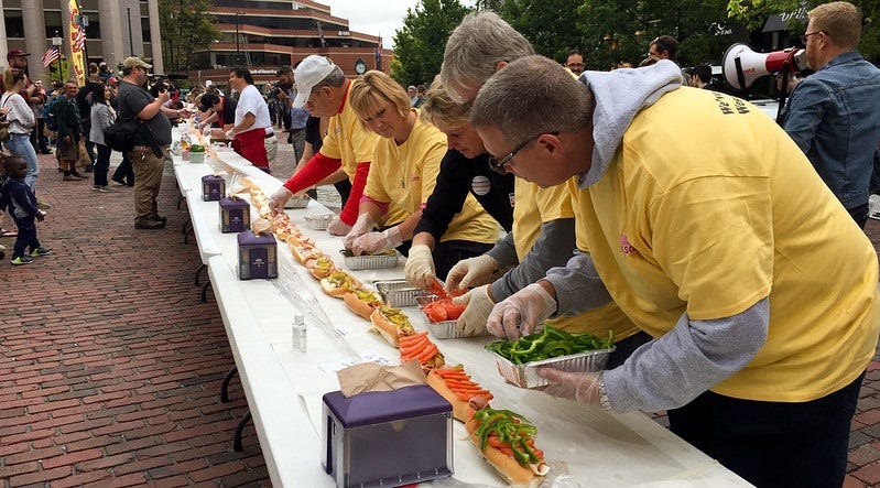 People from Portland, Maine building a world record longest ham Italian sandwich.