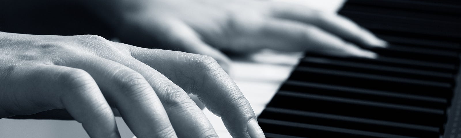 Young woman playing piano — Dmitril Kotin on Adobe Stock — licensed