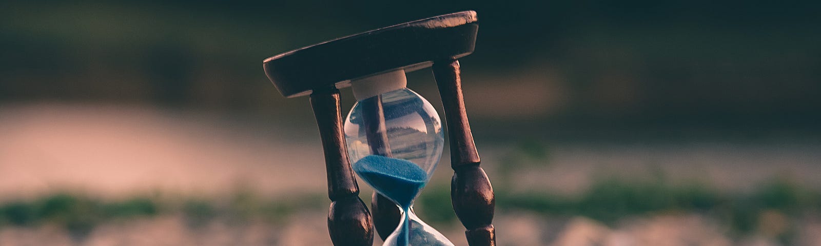 A blue timer sitting on rocks