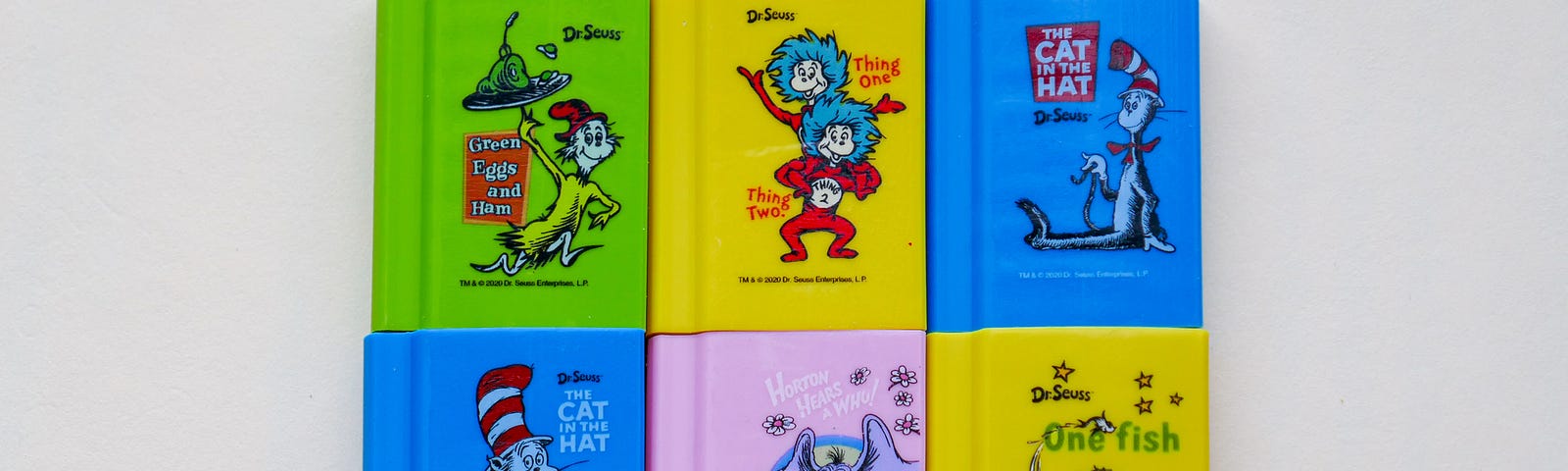 A photo with covers of Dr. Seuss books.