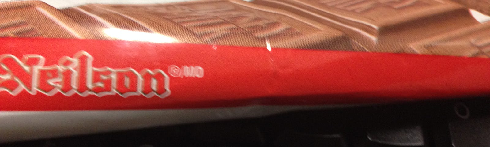 A keyboard under a chocolate bar wrapper