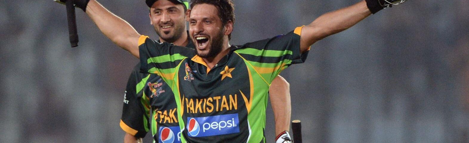 A Pakistan player celebrates after a big player in a cricket game