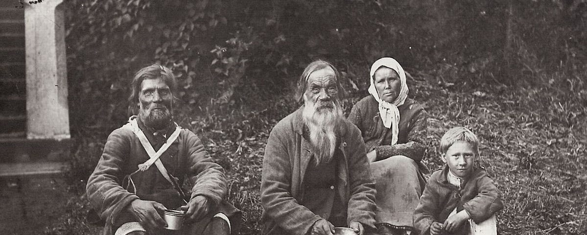 Travelling Russian Day Laborers near St. Petersburg taking a rest.