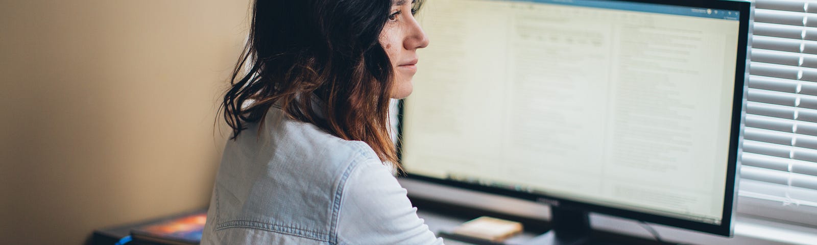 A young lady working on her computer.