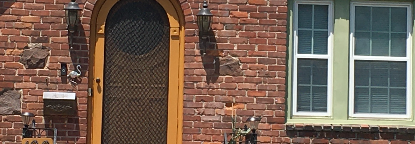 the front door of a brick house