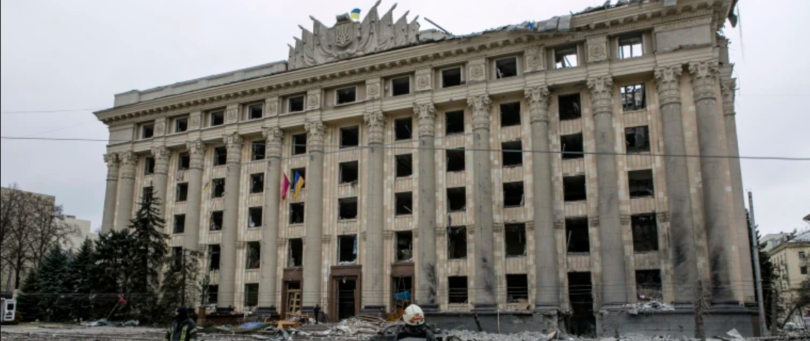 A lone Ukrainian fireman stands in the ruins of Kharkiv’s Freedom Square — Ukraine’s largest plaza — after a missile hit destroyed a prominent landmark building.