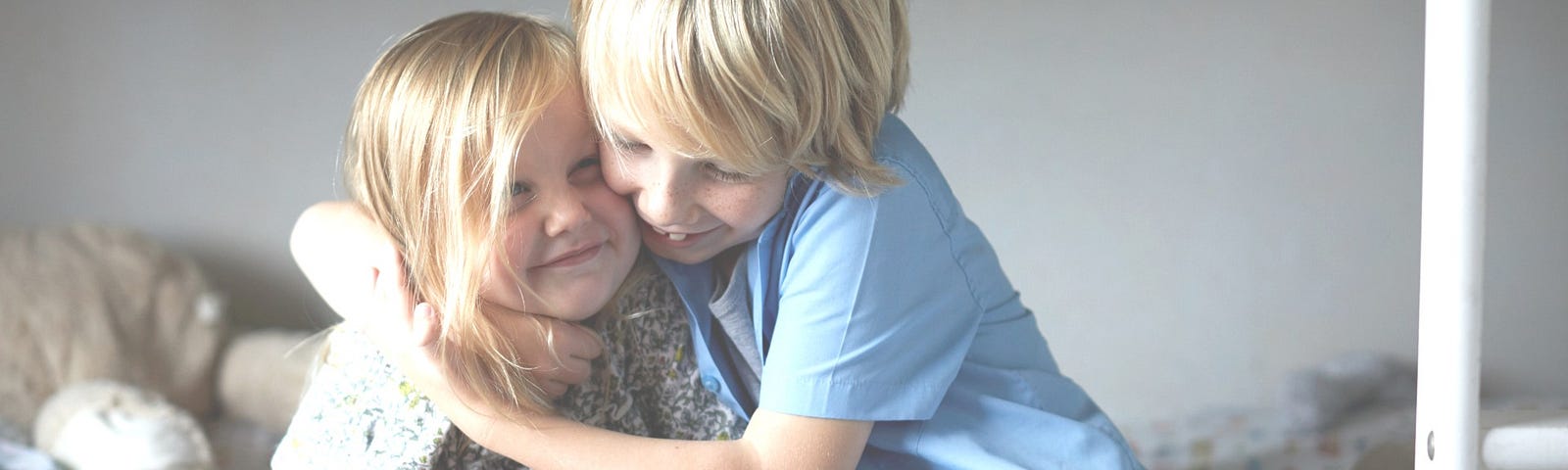 Brother hugging his sister.