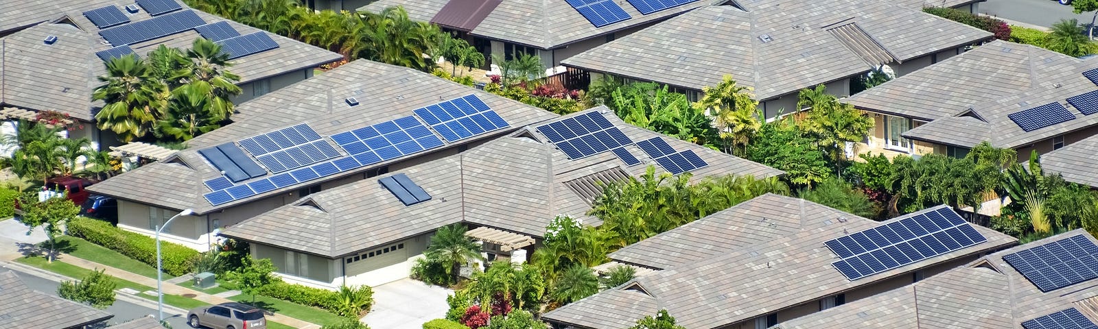 IMAGE: A drone view of a neighborhood with many roofs covered with solar panels