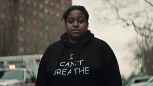Photograph of Erica Garner wearing a sweatshirt that says “I Can’t Breathe”