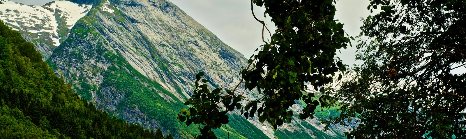 Image of a tall, rock-faced mountain in Norway