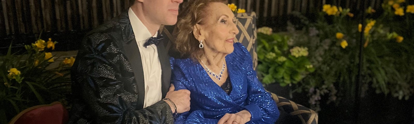 Photo of Helena elegantly dressed in a blue ball gown at her 100th birthday celebration